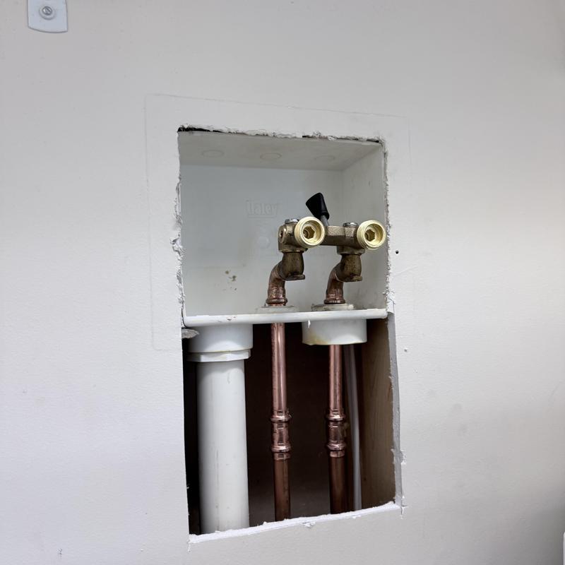 Laundry valve box with copper plumbing pipes