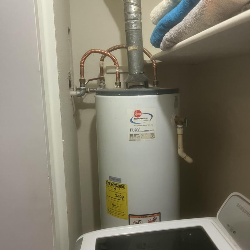 Water heater with new copper piping in utility closet