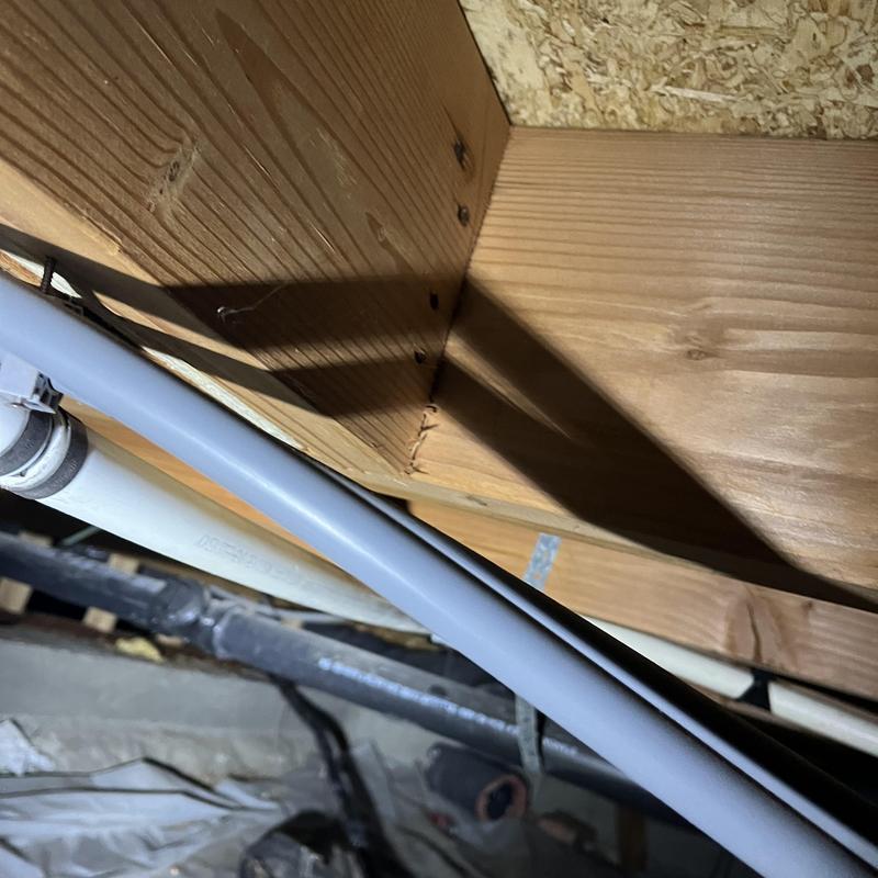 Pex piping installation below wooden joists