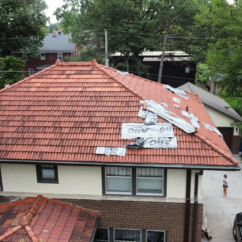 French roof tiles with repair materials on house roof French roof tiles with repair materials on house roof