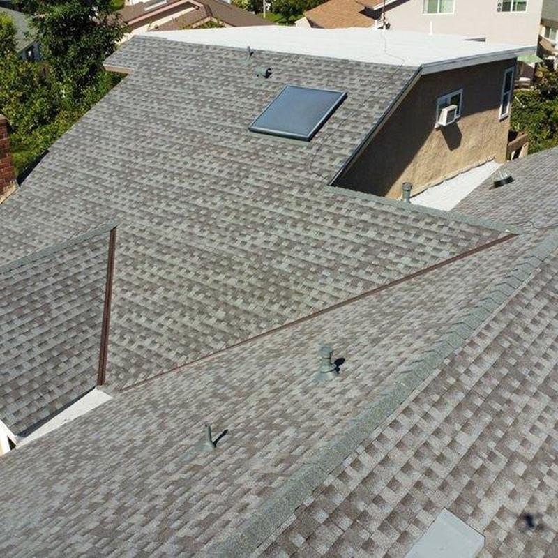 Asphalt shingle roof with skylight and vents Asphalt shingle roof with skylight and vents
