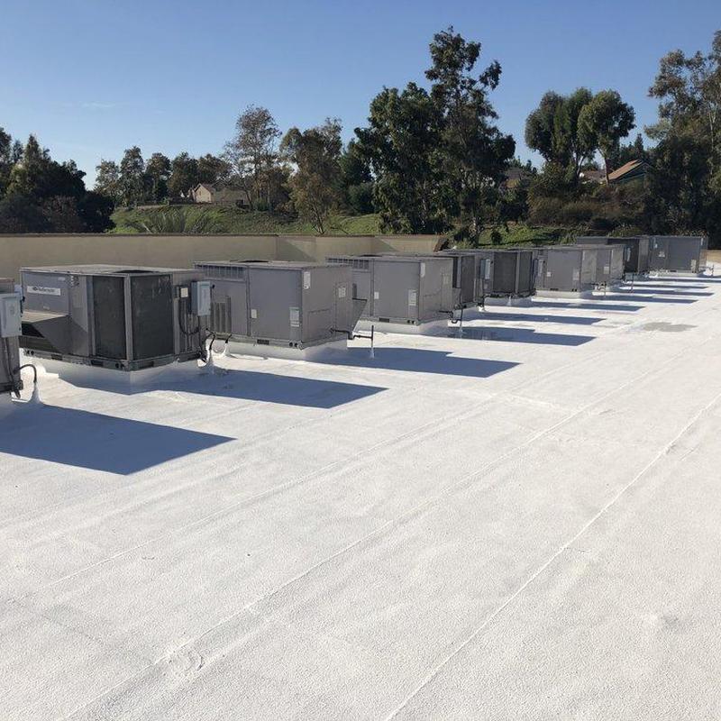 Commercial rooftop HVAC units on white membrane roof Commercial rooftop HVAC units on white membrane roof