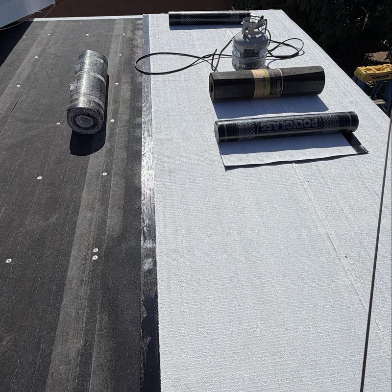 Torch down roofing membrane installation with propane tank Torch down roofing membrane installation with propane tank