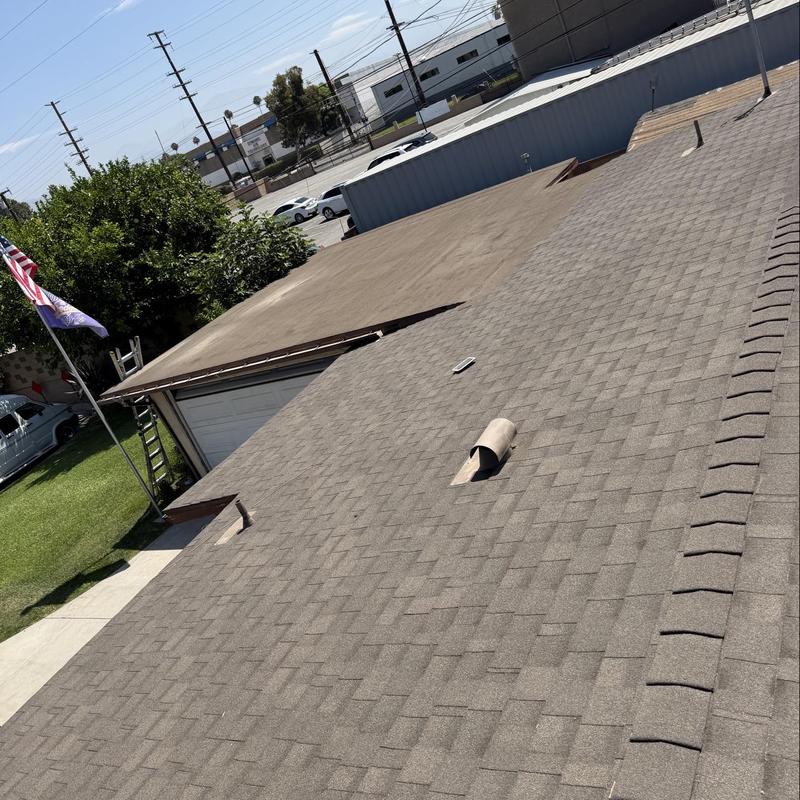 Shingle roof with vent pipe and ridge cap inspection Shingle roof with vent pipe and ridge cap inspection