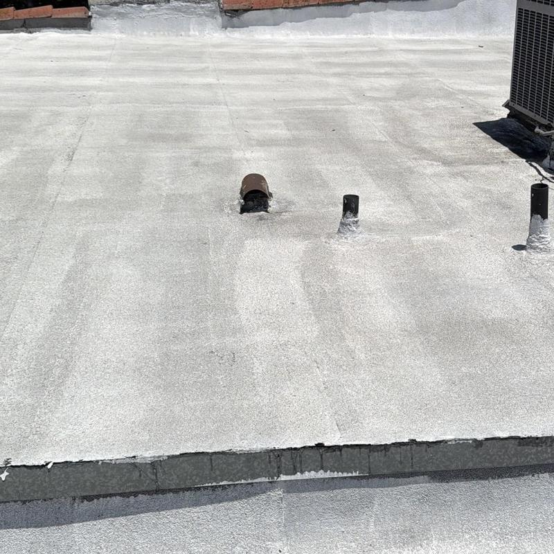 Torch down roll flat roof with vents and HVAC unit Torch down roll flat roof with vents and HVAC unit