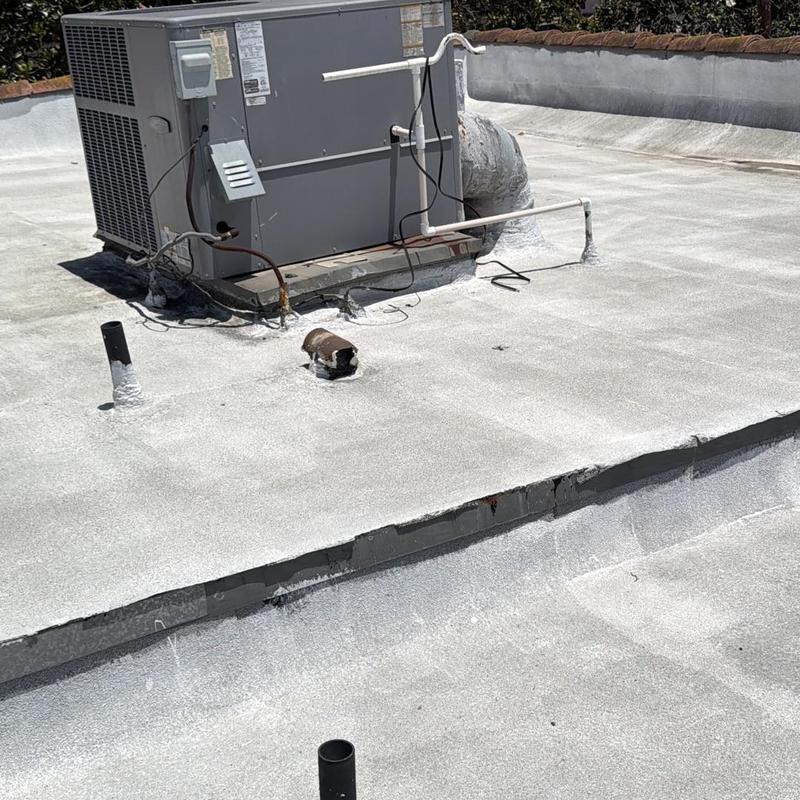 Flat roof torch down roll with HVAC unit on roof Flat roof torch down roll with HVAC unit on roof