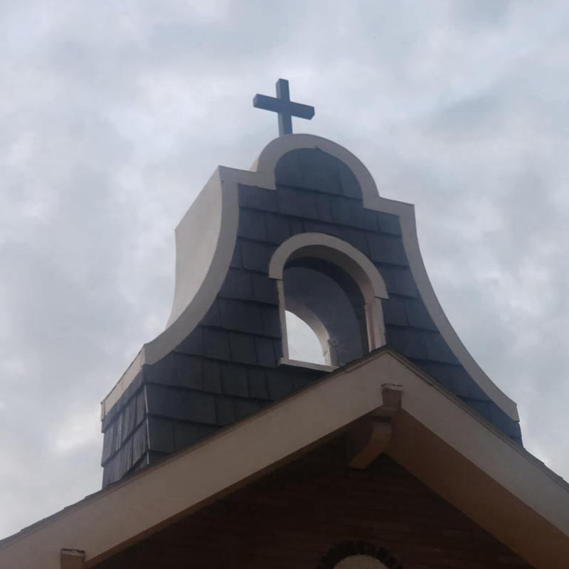Composite cedar shake shingles on church steeple roof Composite cedar shake shingles on church steeple roof