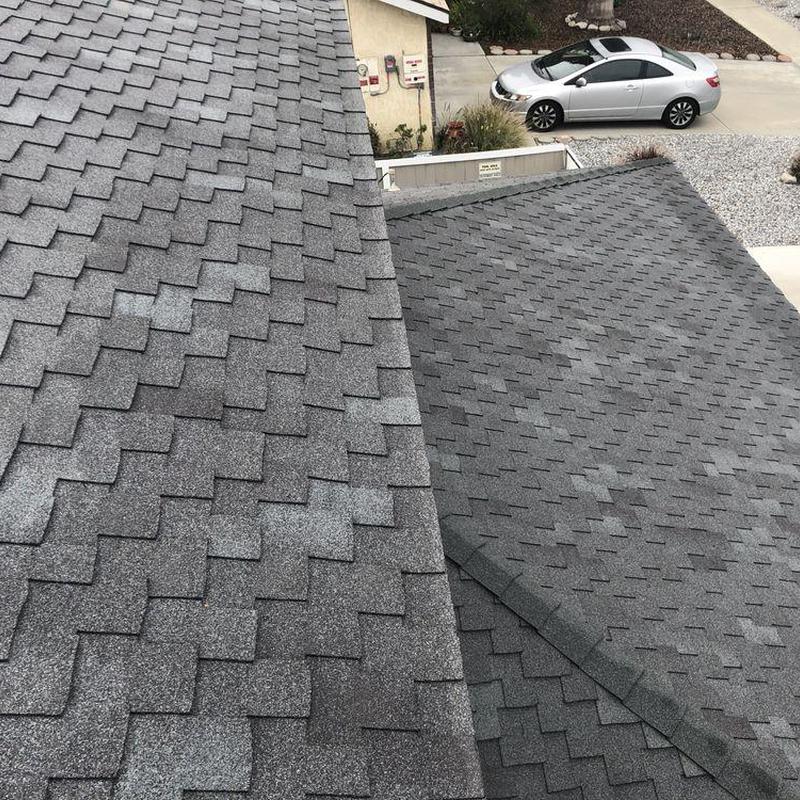 Shingle roof close-up with visible wear patterns Shingle roof close-up with visible wear patterns