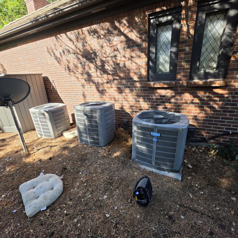 American Standard outdoor air conditioner units by brick wall American Standard outdoor air conditioner units by brick wall