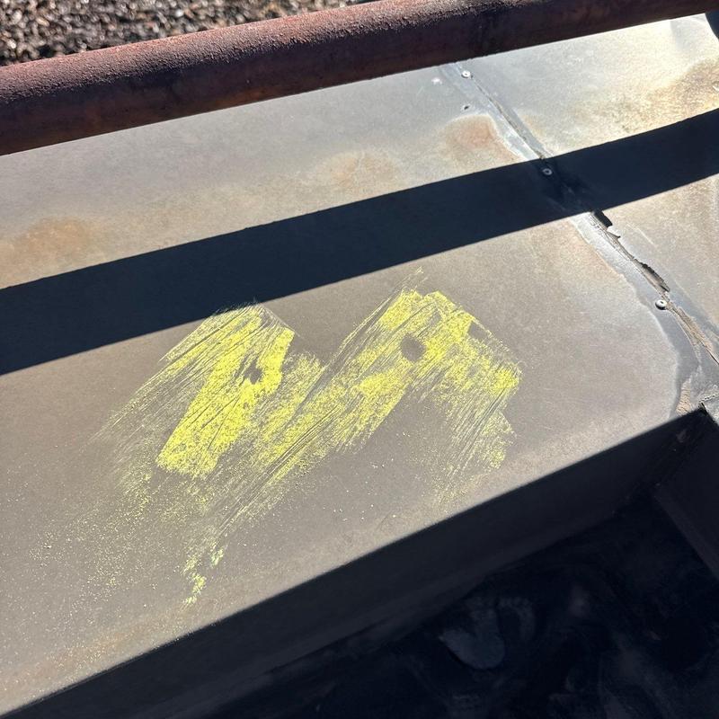 Commercial roof metal panel with hail damage markings