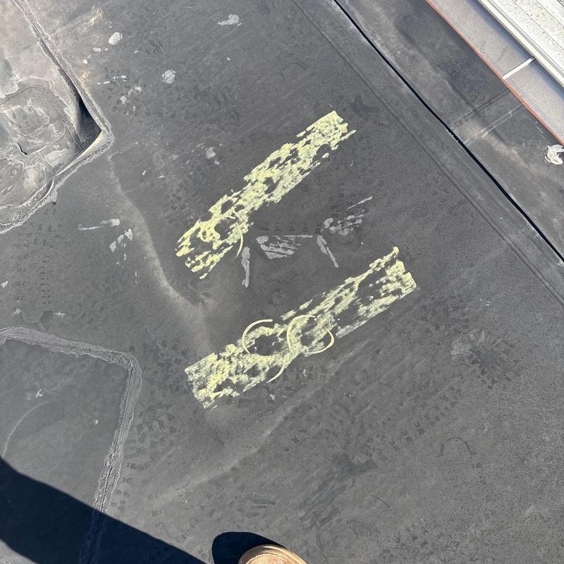 Commercial roof membrane with hail damage markings