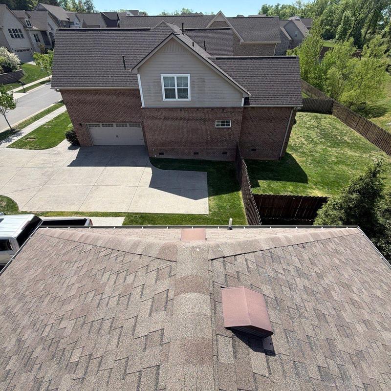 Asphalt shingle roof with hail damage inspection