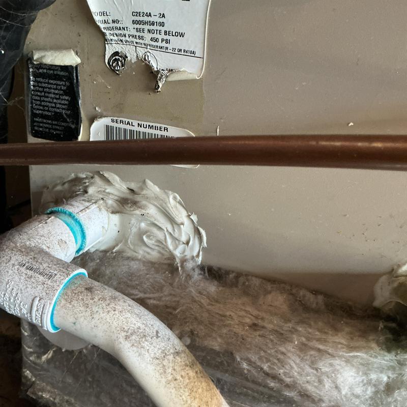 Furnace condensate drain pipe with sealant buildup