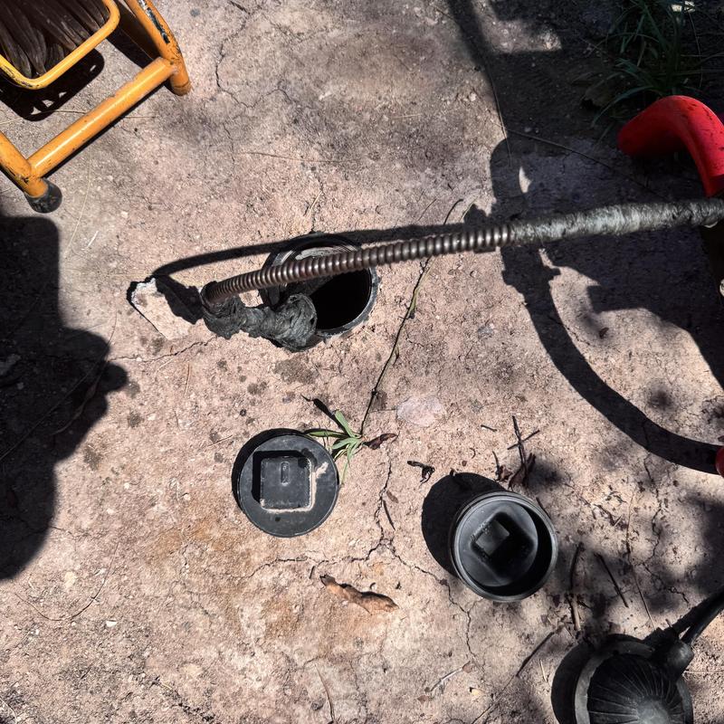 Cast-iron pipe clog with root intrusion and wipes removal Cast-iron pipe clog with root intrusion and wipes removal