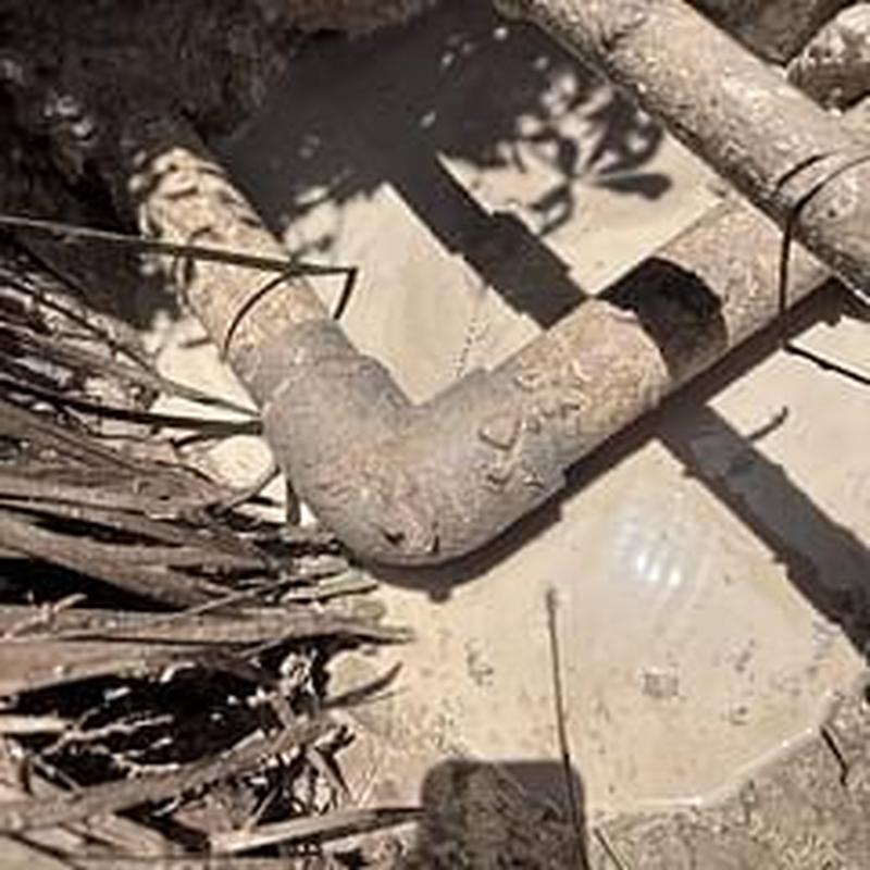 Main water line pipe joint exposed for leak repair Main water line pipe joint exposed for leak repair