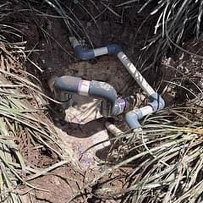 Main water line with PVC pipe repair outdoors Main water line with PVC pipe repair outdoors