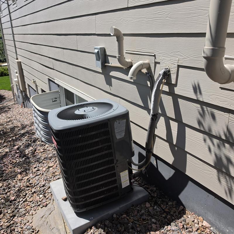 Goodman air conditioner unit with connected piping and drain Goodman air conditioner unit with connected piping and drain