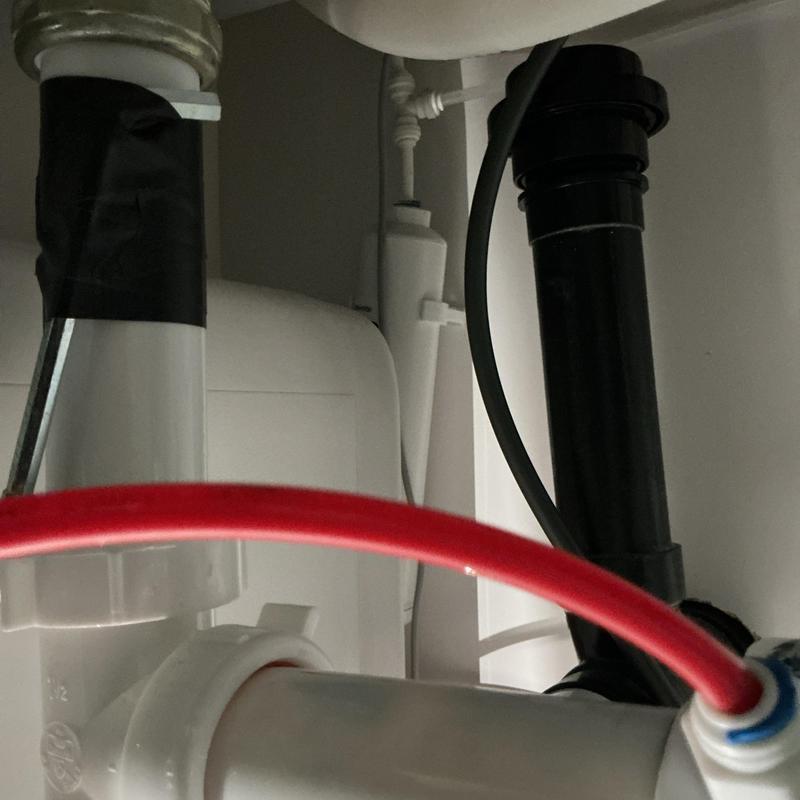 Refrigerator water line installation with red tubing Refrigerator water line installation with red tubing
