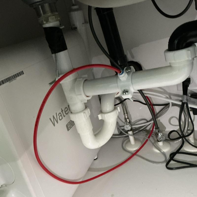Refrigerator water line and drain pipe installation under sink Refrigerator water line and drain pipe installation under sink