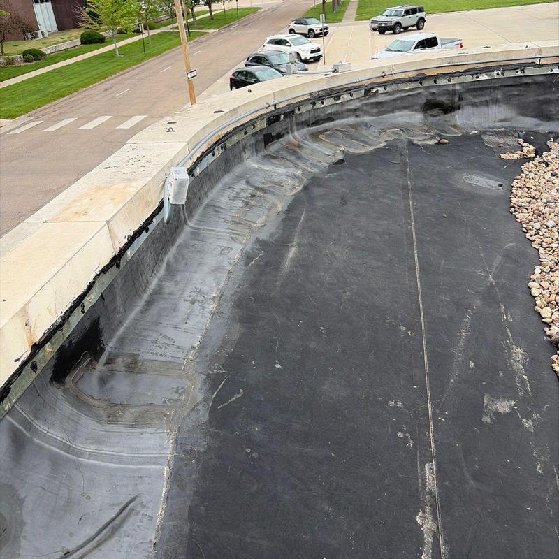 EPDM roof membrane with edge flashing and gravel ballast EPDM roof membrane with edge flashing and gravel ballast