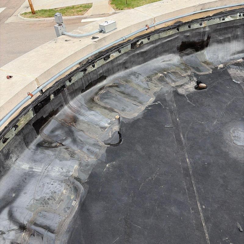 EPDM roof patching and sealing on curved edge EPDM roof patching and sealing on curved edge