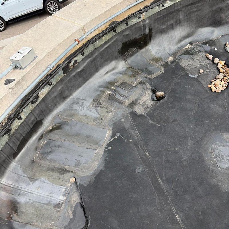 EPDM roofing membrane with patch repairs and sealant EPDM roofing membrane with patch repairs and sealant