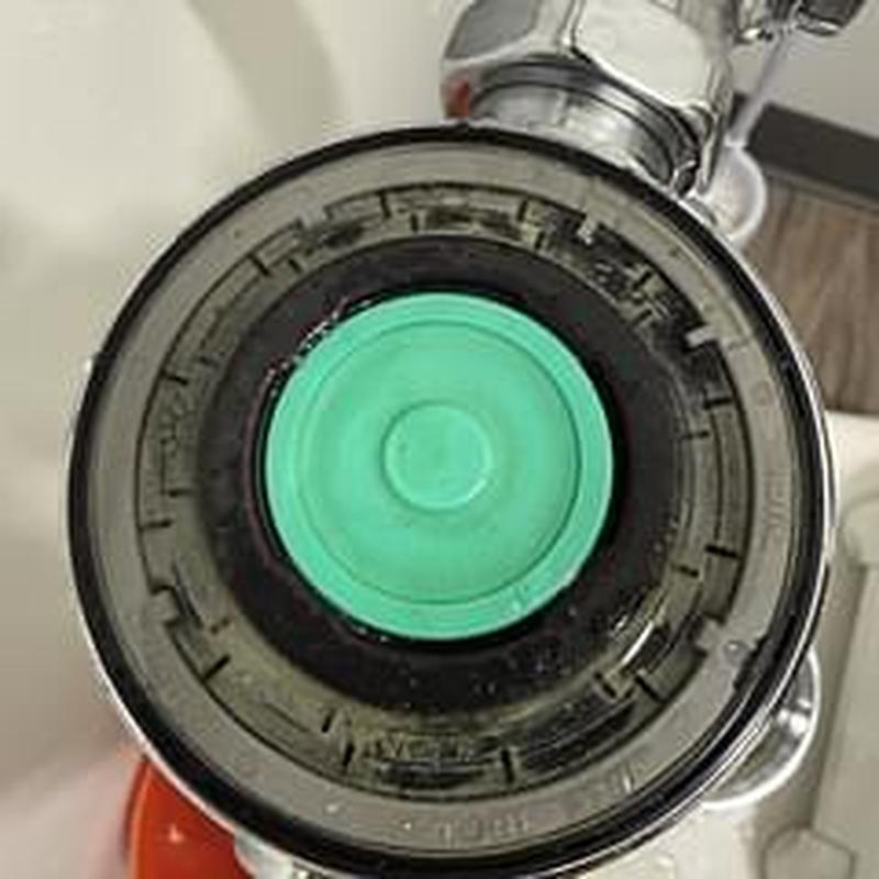 Sloan flush valve vacuum breaker assembly close-up Sloan flush valve vacuum breaker assembly close-up