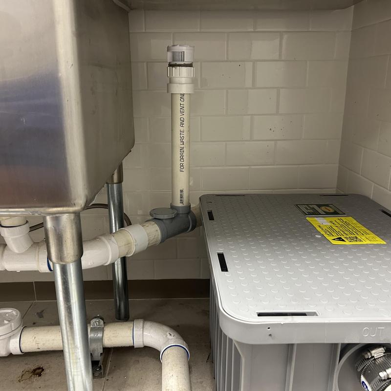 Grease interceptor vent pipe and sink drain system