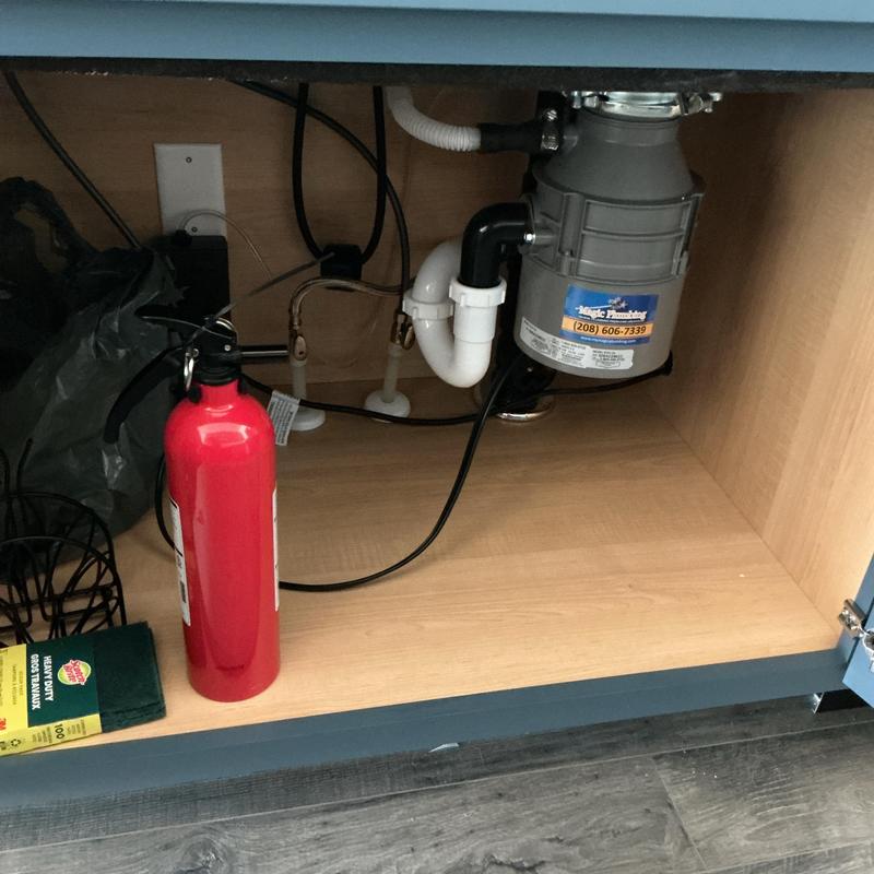 Garbage disposal installation under kitchen sink