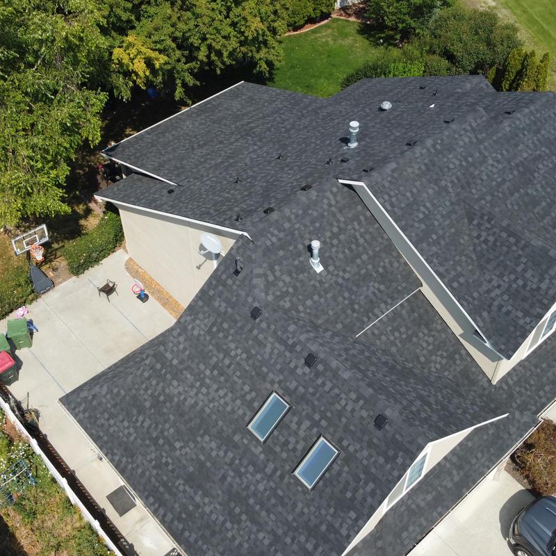 IKO Dynasty granite black roof shingles on house IKO Dynasty granite black roof shingles on house