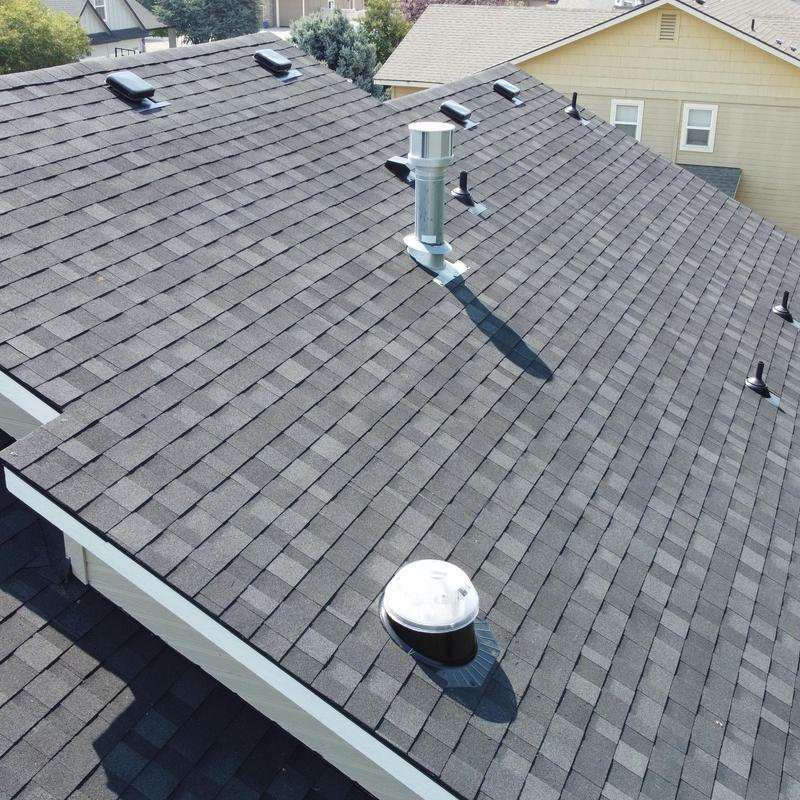 IKO Dynasty shingle roof in granite black on house IKO Dynasty shingle roof in granite black on house