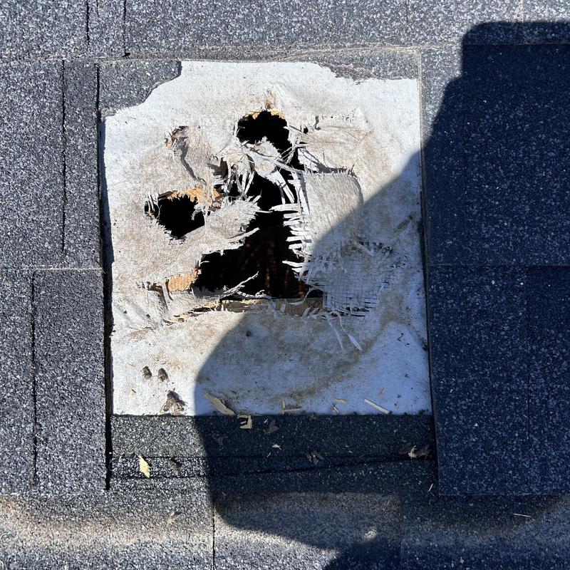 Roof vent damaged underlayment with surrounding shingles Roof vent damaged underlayment with surrounding shingles