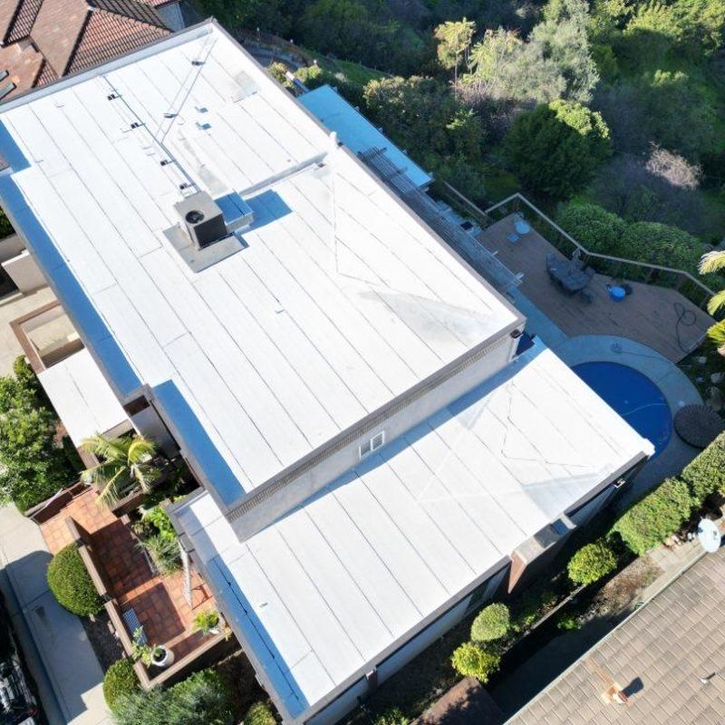 Commercial TPO roofing system on residential building Commercial TPO roofing system on residential building