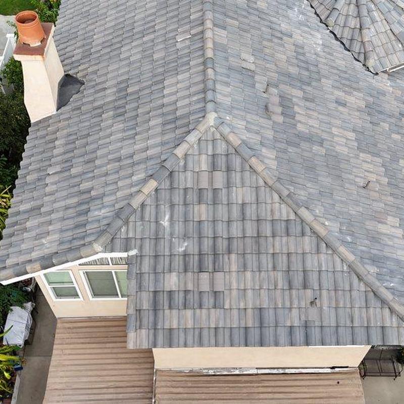 Tile roof inspection showing ridge lines and chimney flashing Tile roof inspection showing ridge lines and chimney flashing