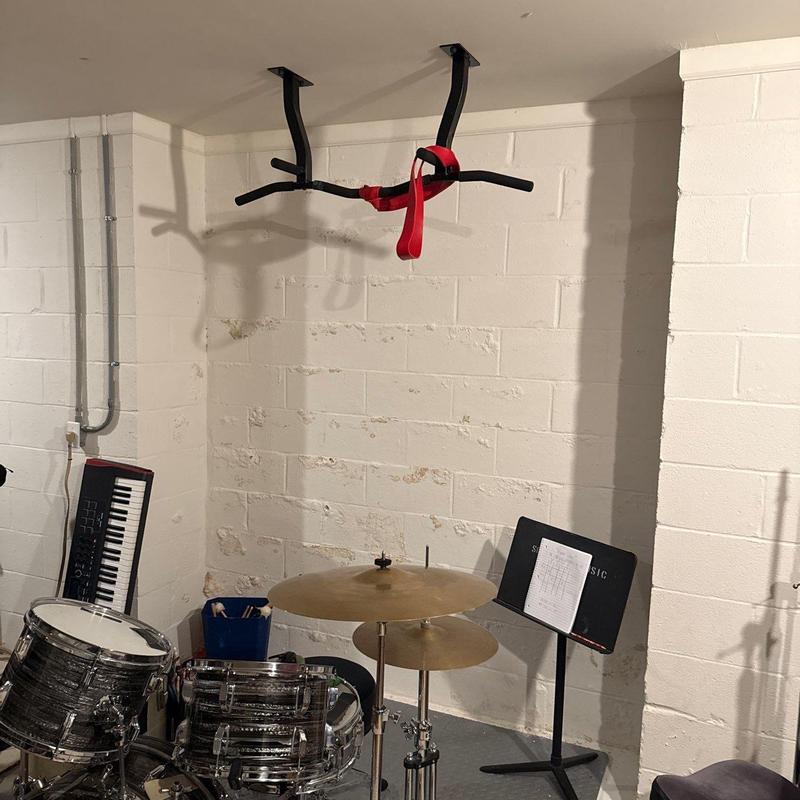 Ceiling-mounted pull-up bar with red strap