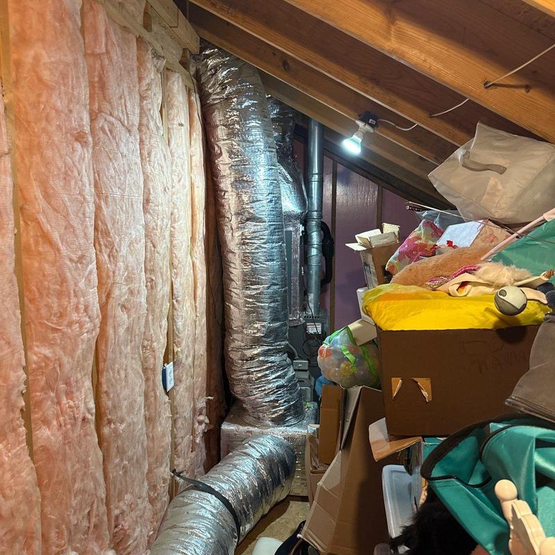 HVAC ductwork and furnace in attic storage space