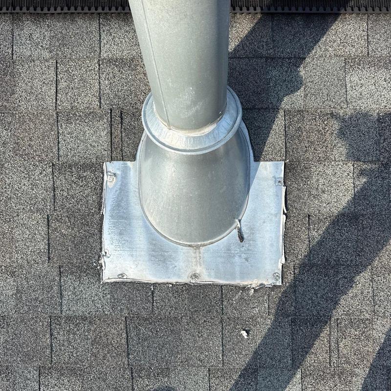 Roof vent pipe flashing on asphalt shingle roof