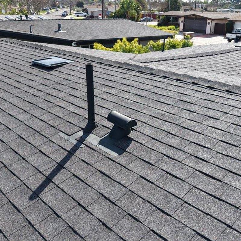 Asphalt shingle roof with vent pipes installed Asphalt shingle roof with vent pipes installed