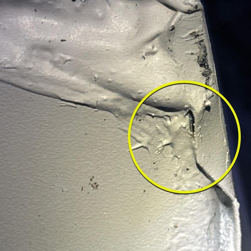 Roof flashing with hail damage and cracks