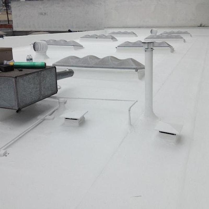 Commercial white TPO roofing with vents and ductwork Commercial white TPO roofing with vents and ductwork