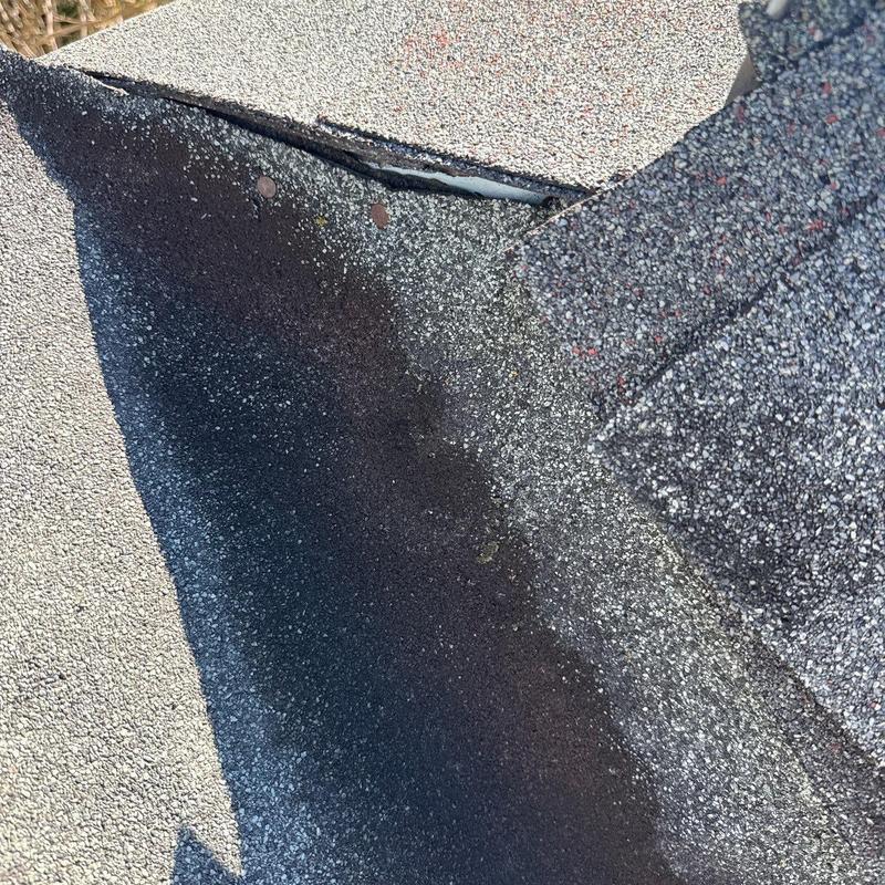 Roof flashing with hail damage and shingle wear