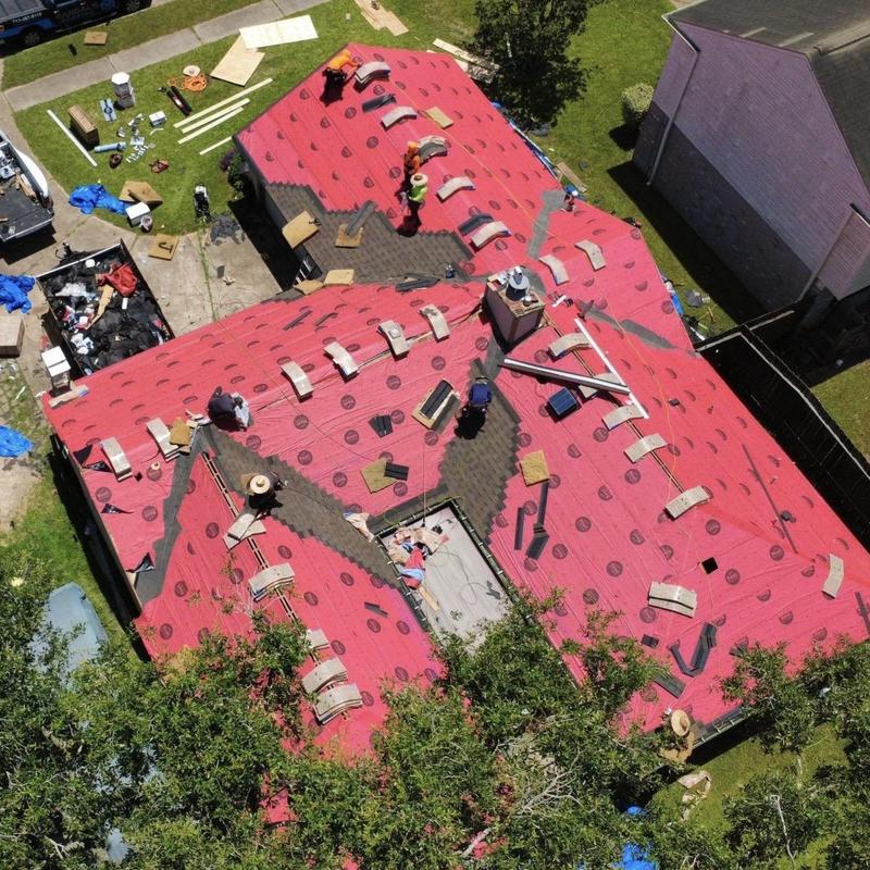 Synthetic underlayment installation on residential roof