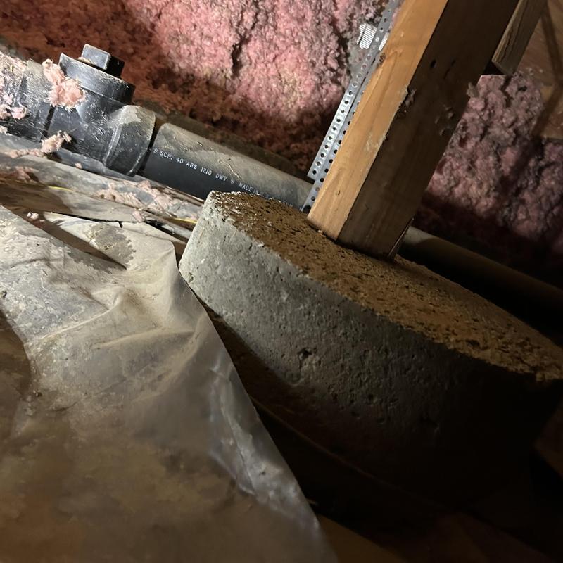 ABS waste pipe in attic crawl space with insulation