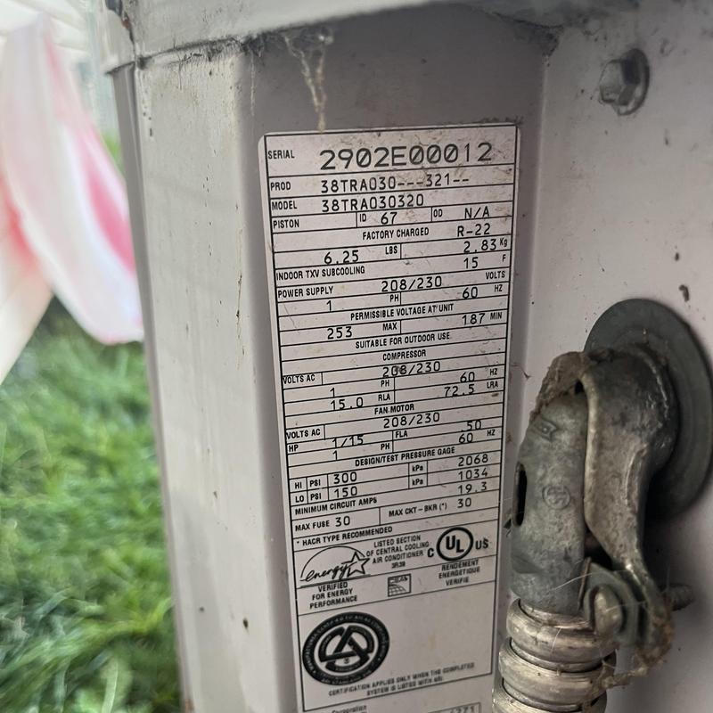 Carrier 2002 AC unit capacitor label and wiring close-up Carrier 2002 AC unit capacitor label and wiring close-up