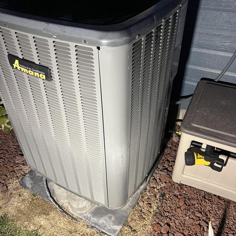 Amana outdoor air conditioning unit on concrete pad Amana outdoor air conditioning unit on concrete pad