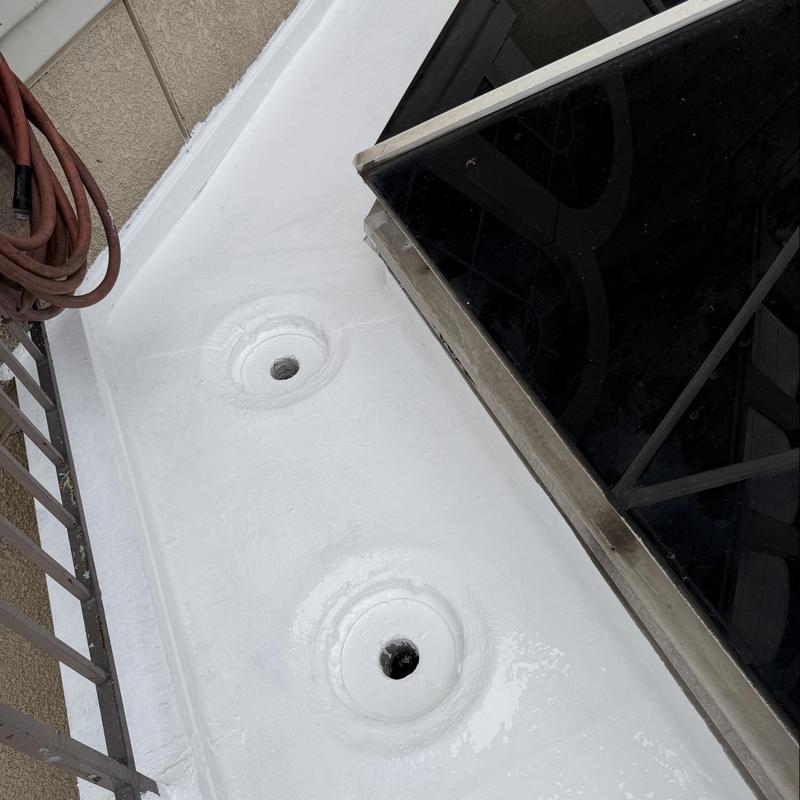 Flat roof silicone coating around drain openings Flat roof silicone coating around drain openings