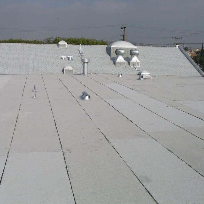 Commercial flat roof with vents and exhaust systems Commercial flat roof with vents and exhaust systems
