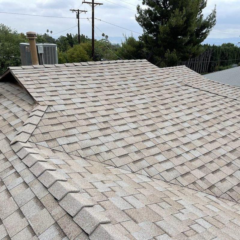 Asphalt shingle roof installation with ridge vents Asphalt shingle roof installation with ridge vents