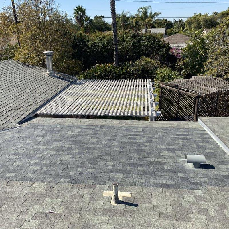 Shingle roof with vent pipes and pergola cover Shingle roof with vent pipes and pergola cover