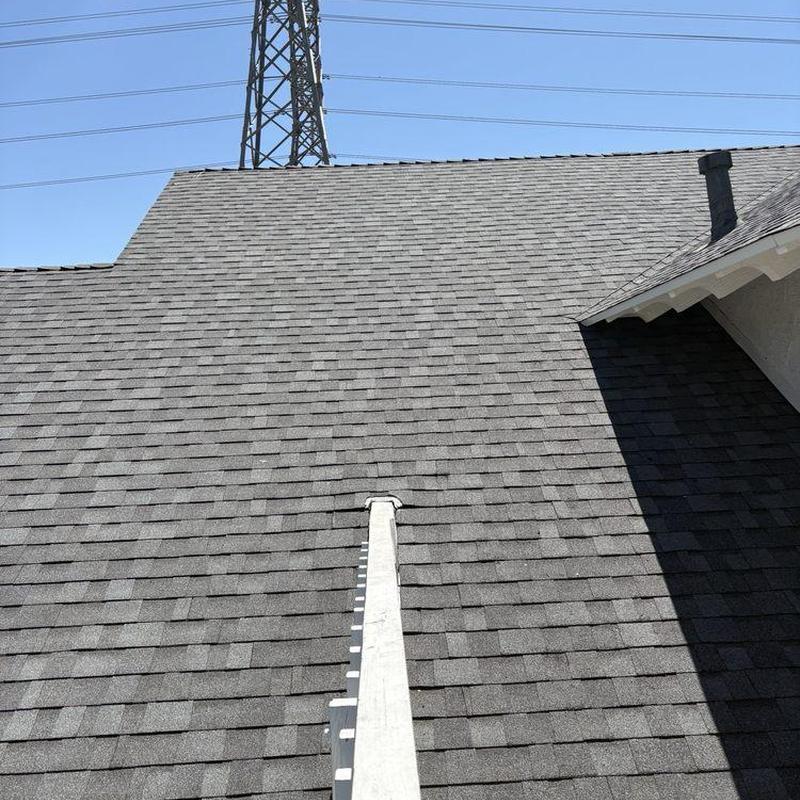 Asphalt shingle roof with ridge vent installation Asphalt shingle roof with ridge vent installation